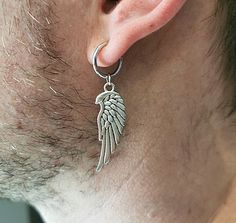 One Wing earring Metal wing clip-on Non pierced, Silver wing clip-on men earring men gift amulet clip-on symbol wing clip-on protection clip-on men wing talisman, protection wing Silver color wing size is 1.8 Inches ( 47 mm) Charm length 33 mm Circle size 14 mm Mens Clip On Earrings, Pierced Men, Metal Wings, Silver Wings, Wing Earrings, Men Earrings, Ear Jewelry, Star Patterns, Clip On