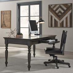 an office desk with a computer on it in front of a large window and two chairs