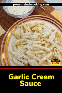 garlic cream sauce on a plate next to some pasta