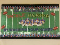 a football themed bulletin board hanging on the wall