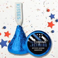 a blue foiled lollipop next to a red, white and blue confetti