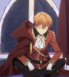 an anime character sitting on the ground with his hands in his pockets and wearing a red cape