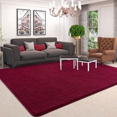 a living room filled with furniture and a red rug