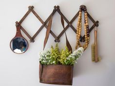 a potted plant sitting next to a mirror on a wall