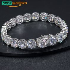 This glamorous moissante Diamond tennis bracelet is crafted in lustrous sterling silver. This alluring Ice Out bracelet features round with shimmering 10mm VVS tennis style jewelery Our bracelet is made with the greatest attention to quality and minutest details and enhances with a high polish finish, Its stunning sparkle design with precision craftsmanship gives you the best hiphop bracelet to wear and admire without being too loose This custom Cuban link moissanite bracelet is cheap but with h