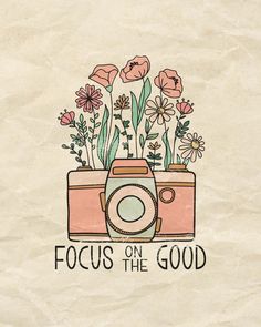 a camera with flowers in it and the words focus on the good written above it