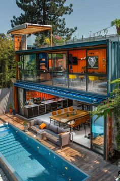 an aerial view of a house with a swimming pool and patio area in the foreground