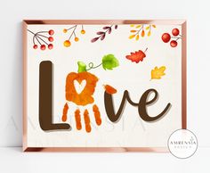 a wooden sign that says love with leaves and acorns on the bottom, in front of a white background