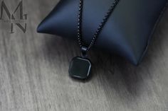 The Onyx Square Necklace makes for great casual trendy wear and holds a black onyx stone at its centre. - Material: 316L Stainless Steel - Gemstone: Black Onyx - Plating: Black IP Plated - Chain Type: Box Chain - Chain Length: 60cm - Chain Width: 2mm - Chain Clasp: Lobster Clasp - Pendant Length: 15mm - Pendant Width: 15mm - Finish: Matte ✔ Resistant to Rusting, Greening and Fading ✔ Waterproof, Heatproof, Sweatproof & Hypoallergenic ✔ Comes with a Black Velvet Gift Bag ■ Personalised Engraving Stone Jewellery, Personalised Jewellery, Mens Necklace, Square Necklace, Black Onyx Necklace, Necklace Pendants, Onyx Necklace, Black Onyx Stone, Personalized Pendant