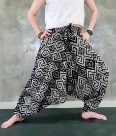 "Material:100% cotton,  hmong fabric, thai, japanese print FEATURE: Handmade Ethically, Breathable, Unisex, Comfortable to Wear & Stylish. Description Harem pants 2 Pockets Striped Printed Cotton Baggy pants, Yoga pants, Harem pants,Hmong pants, Low Cut pants, Hippie pants, Unisex Printed Cotton Baggy pants is inspired from Hill tribe and Hmong Clothing in the Northern of Thailand. Created and Designed for Everyone. Pants is made of 100% Cotton and Printed with beautiful pattern design. 100% Handmade by Thai Craftsmanship. This pants is very comfortable and Easy to wear. Printed Cotton Baggy pants has one Pocket in front. Cotton Baggy pants great for any Occasion, Chill out, Free Style, Yoga, Traveling, Dancing, Going to Festivals, Working out , Martial arts, Etc... Sizing : One size fits Bohemian Cotton Wide-leg Harem Pants, Casual Cotton Harem Yoga Pants, Cotton Yoga Pants With Tapered Leg, Bohemian Baggy Pants With Tapered Leg, Bohemian Harem Pants With Tapered Leg, Black Cotton Hippie Harem Pants, Traditional Relaxed Fit Harem Pants For Yoga, Cotton Harem Yoga Pants, Baggy Cotton Harem Yoga Pants