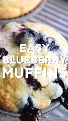 two blueberry muffins sitting on top of a cooling rack with the words easy blueberry muffins