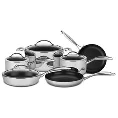 an assortment of pots and pans on a white background