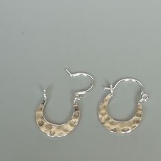 Sterling silver beaten and hammered ethnic hoops. Dimensions: 14 x 13 mm Drop length: 23 mm Price listed is for ONE PAIR. These earrings are made of 925 hypoallergenic sterling silver. Please note this price is for ONE PAIR only. All my pieces are sent in a gift box. I can include a personal message from you if needed You are welcome to contact me at... bhavnakwintra1956@gmail.com For more beautiful pieces from my shop, please browse 👇 TOE RINGS: https://www.etsy.com/your/shops/TheSilverGame/to Hoop Earrings Silver, Hammered Silver, Toe Rings, Silver Hoops, Silver Hoop Earrings, Earrings Silver, Personal Message, Earring Gifts, Silver Earrings