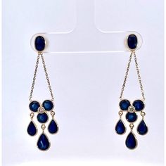 I just love these earrings.  They are made up in 18K Yellow Gold and feature round, oval and pear cut Sapphires totally 7.21 Carats round and brilliant Diamonds approx. 0.12 carats H-I VS.  These are mini Chandelier earrings and measure 1 3/4" long and weighs 3.57 grams. You can wear these with everything as they are truly spectacular but doesn't overpower anything else you may be wearing. These Sapphires are eye clean and a beautiful color of true Sapphire Blue.  They also do not tangle as many do, they hang nicely and you will receive many compliments on these beautiful earrings.  Do not wait, they will be gone. Teardrop Chandelier Earrings With Diamond Accents For Formal Occasions, Formal Teardrop Chandelier Earrings With Diamond Accents, Elegant Teardrop Diamond Earrings Fine Jewelry, Teardrop Diamond Earrings With Elegant Design, Luxury Teardrop Chandelier Earrings For Formal Occasions, Formal Yellow Gold Diamond Chandelier Earrings, Elegant Yellow Gold Chandelier Earrings With Cubic Zirconia, Elegant Yellow Gold Chandelier Earrings With Diamond Accents, Luxury Teardrop Chandelier Earrings For Anniversary