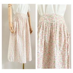 "Cute 70s Cacharel midiskirt Made from a cotton liberty printed floral fabric Closes at the back with a zipper The skirt has pocket at the side UK Size: 6-8 (xs-s), US: 4-6, EU: 34-36 Waist: 33,5 cm - 13,2\" Length: 72 cm - 28,4 \" Material: 100% cotton In perfect condition This item has been washed and steamed so that there are no more odors. This item is vintage, which means 25 years or older. Small flaws are not uncommon, but we do our best to mention them in the description Return Policy: It Spring Cotton Peasant Skirt, Peasant Cotton Skirt For Spring, Cotton Peasant Skirt For Spring, Feminine Cotton Floral Print Skirt, Cottagecore Cotton Skirt For Summer, Cotton Floral Print Skirt For Garden Party, Vintage Cotton Floral Print Skirt, Vintage Cotton Skirt With Floral Print, Bohemian Cotton Skirt For Garden Party