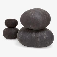 three black rocks stacked on top of each other