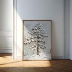 a painting on the wall in an empty room with wood flooring and white walls