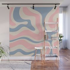 a living room with a large wall mural in pastel colors and wooden flooring