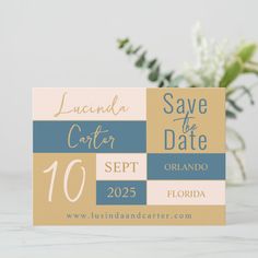 the save the date card is next to a vase with flowers in it on a table