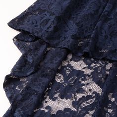 Navy Blue Sleeveless High Low Halter Lace Party Dress Sleeveless Lace Mini Dress For Wedding Guest, Blue Lace Dress For Party Season, Blue Strapless Sleeveless Dress For Party, Blue Lace Mini Dress For Party, Lace Sleeveless Mini Dress For Party, Blue Lace Sleeveless Mini Dress, Blue Lace Sleeveless Dress, Blue Sleeveless Evening Dress With Ruffles, Lace Party Dress