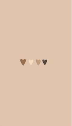 three hearts on a beige background