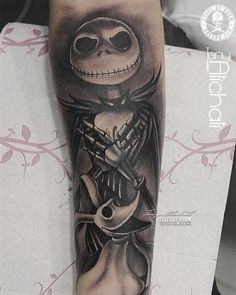 a tattoo with a skeleton holding a guitar on it's arm and wearing a hat