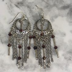 These OOAK chain dangles are made with beautiful amethyst Swarosvki bicone crystals, glass swirl bugle beads, & non-tarnishing, stainless steel chain.  They hang 2 3/4 inches in length on beautiful silver connectors with French ball ear wires.  They're absolutely stunning and can be worn year round Silver Chandelier Earrings With Dangling Charms As Gift, Purple Metal Dangle Earrings, Purple Dangle Metal Earrings, Purple Metal Dangle Chandelier Earrings, Silver Crystal Earrings With Dangling Beads, Silver Round Crystal Earrings With Dangling Beads, Silver Chandelier Earrings With Dangling Beads, Purple Metal Chandelier Dangle Earrings, Metal Crystal Dangle Earrings