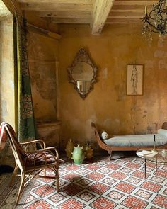 a living room with a couch, chair and mirror