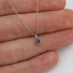 Very classy, simple, and dainty. This handcrafted gold pendant has a natural Sapphire stone and comes on your choice of a 16 inch or an 18 inch 14kw gold chain. It can also be paired with other pendants! Mix and match to create your own personalized necklace or mother necklace! Gold is 14k white with a rhodium plating. Stone measures 3mm in diameter. Birthstone for September. All Laine Benthall jewelry comes with a lifetime warranty. This pendant can also be purchased without the chain, just go Mother Necklace, Mothers Necklace, Sapphire Stone, Natural Sapphire, Drop Necklace, Personalized Necklace, Necklace Gold, Just Go, Gold Pendant