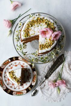 there is a piece of cake on the plate next to it and another slice has been taken out