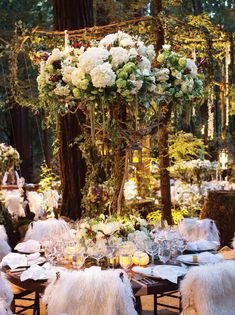 a table with flowers and candles is featured on the instagram page for an event