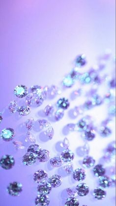 many different colored diamonds are shown in this image, including blue and white colors on the surface