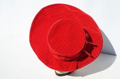 "Vintage Women's Hat Chapeau Asymmetrical Brimmed Red Velvet Mid Century Rockabilly Church Style Bridal Accessory Christmas Hat. There is nothing better than anything red Here's a great example! A beautiful ruby red, velvet hat. The brim is larger in front. Quilting details on the large, wired, front brim and top of the hat. 2 bands of velvet ribbon bows around crown of the hat. No makers markings. It measures approximately 19 1/2\" around inside band. In great condition! Very clean! The crown i Retro Red Party Hat, Red Retro Party Hat, Kitsch Christmas, Church Fashion, Bridal Accessory, Velvet Hat, Costume Hats, Christmas Hat, Velvet Ribbon