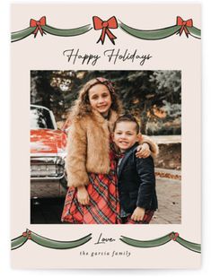 a holiday card with an image of two children