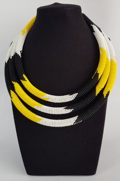 This necklace is 100% handcrafted using original fine beads. Perfect for African themed events and weddings. **Buy multiple items and pay shipping for ONE item only. More neckleces here; https://www.etsy.com/shop/TribalTess?ref=seller-platform-mcnav&section_id=21306083 Back to my shop; https://www.etsy.com/shop/TribalTess?ref=seller-platform-mcnav Yellow Multi-strand Polished Beads Jewelry, Yellow Multi-strand Jewelry With Polished Beads, Yellow Multi-strand Jewelry As A Gift, White Multi-strand Necklace For Gift, Yellow Multi-strand Jewelry Gift, Multi-strand Beaded Necklace For Gifts, Multi-strand Polished Beads Necklace As Gift, Multi-strand Necklace With Polished Beads For Gifts, Multi-strand Necklaces With Polished Beads As Gift