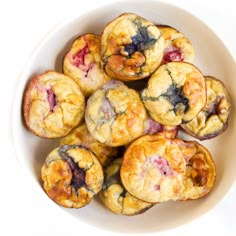 blueberry muffins in a white bowl on a table