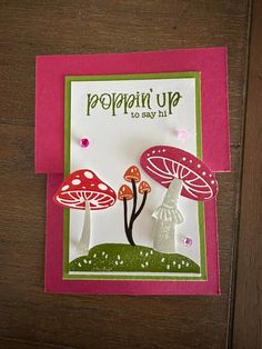 a close up of a card with mushrooms on it