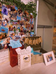 a table topped with pictures and boxes filled with gifts