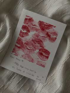 a piece of paper that has been drawn with red crayons on white fabric