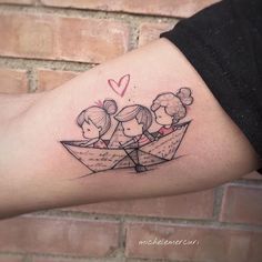 a woman's arm with a tattoo on it that has three girls in a paper boat