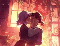 two people kissing each other in front of a window with flowers on the outside wall