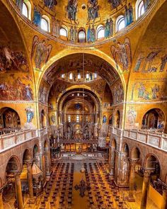 the interior of an old church with many paintings on the walls and ceiling, as seen from above