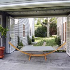 a hammock sitting in the middle of a patio