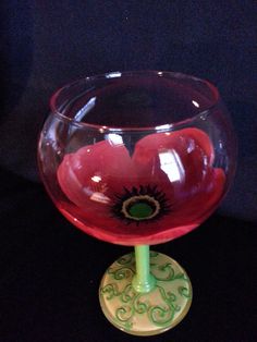 a red glass with an ornate design on it