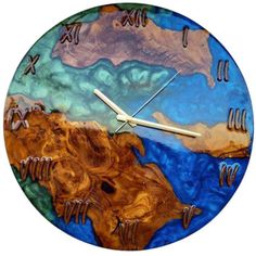 a clock that is made to look like the earth with mountains and water on it