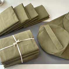 the folded linens are laid out on the table