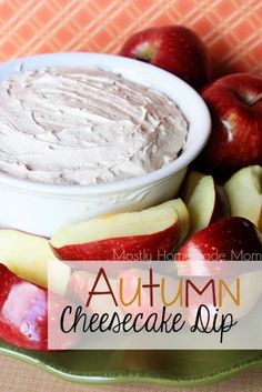 an apple and cheesecake dip on a plate with apples