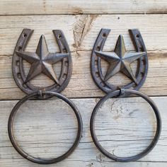 two old horseshoes with star designs on them