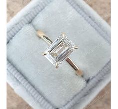 an engagement ring with a princess cut diamond