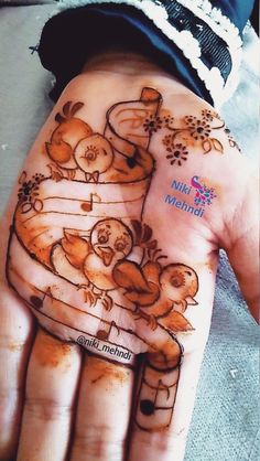 a person's hand with hendi designs on it